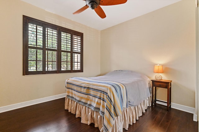 bedroom featuring dark hardwood / wood-style floors and ceiling fan