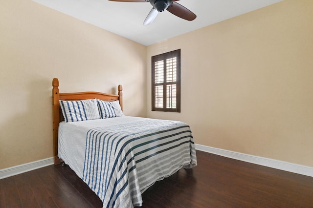 bedroom featuring ceiling fan and dark hardwood / wood-style floors