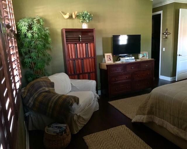 bedroom with crown molding