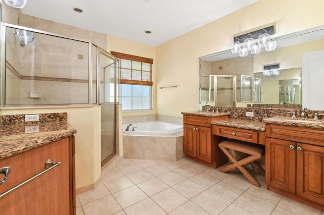 bathroom featuring tile patterned floors, vanity, and separate shower and tub