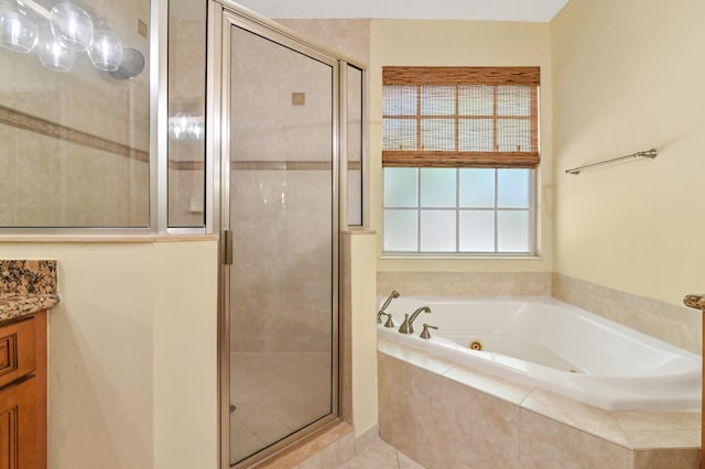 bathroom with vanity, tile patterned floors, and independent shower and bath