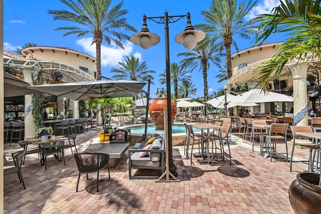 view of patio / terrace featuring a community pool