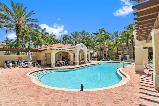 view of swimming pool with a patio