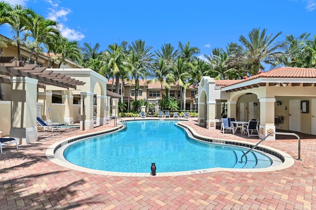 view of swimming pool with a pergola and a patio area