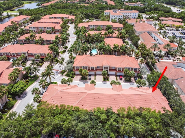 birds eye view of property featuring a water view