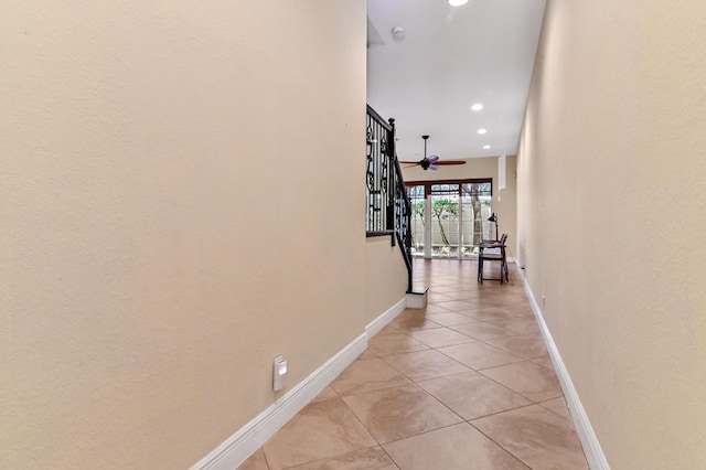 hallway featuring light tile patterned flooring