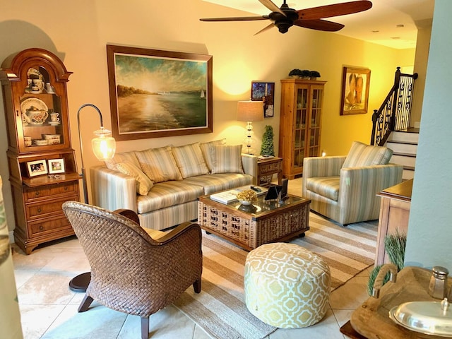 living room featuring ceiling fan and light tile patterned flooring