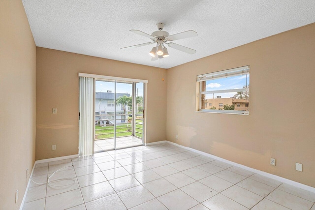 tiled empty room with ceiling fan