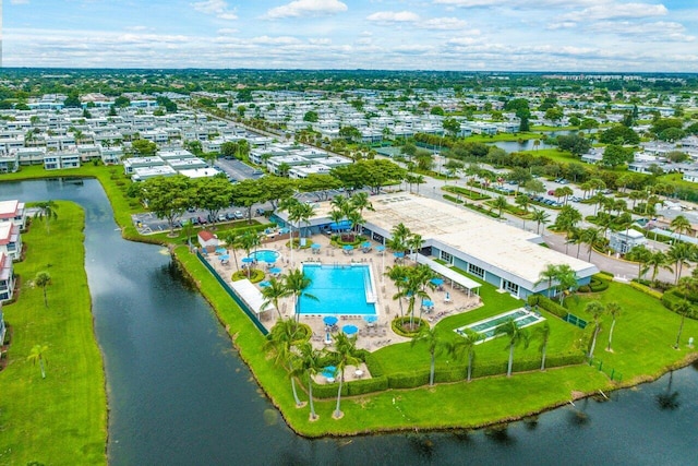 birds eye view of property with a water view