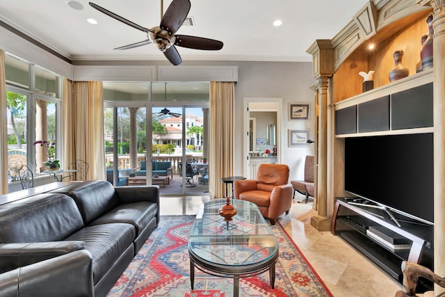 living room featuring crown molding and a healthy amount of sunlight