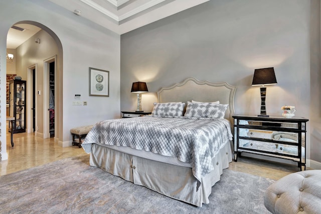 bedroom featuring a high ceiling, a spacious closet, and a closet