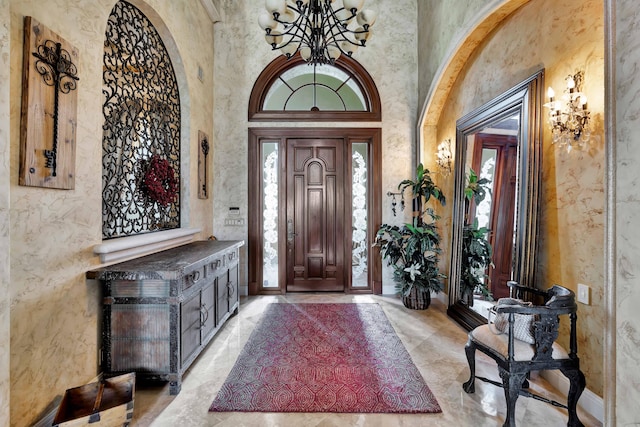 foyer featuring a towering ceiling