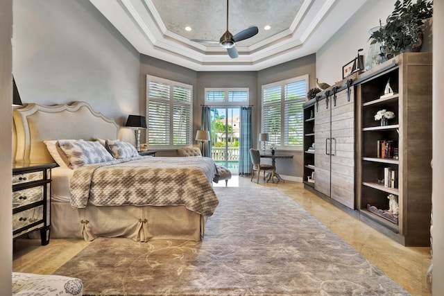 bedroom featuring a high ceiling, a raised ceiling, ceiling fan, and ornamental molding