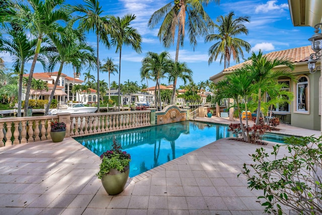 view of swimming pool featuring a patio