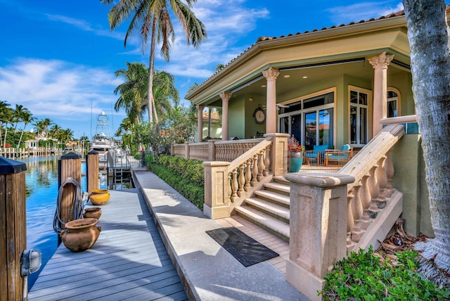 entrance to property with a water view