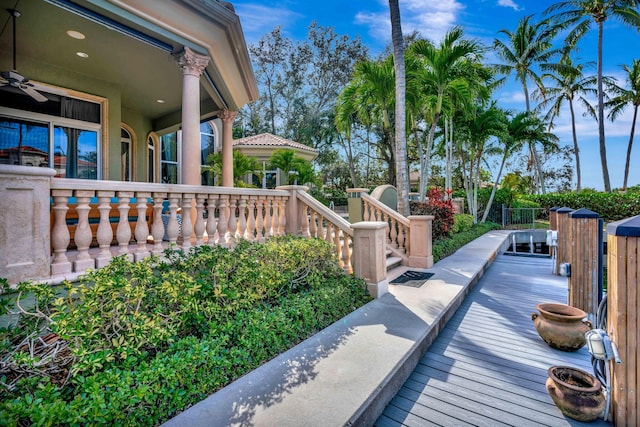 exterior space with ceiling fan