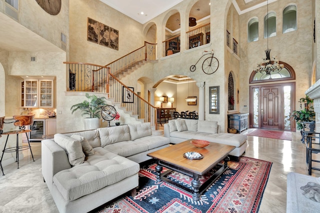 living room with a towering ceiling and beverage cooler