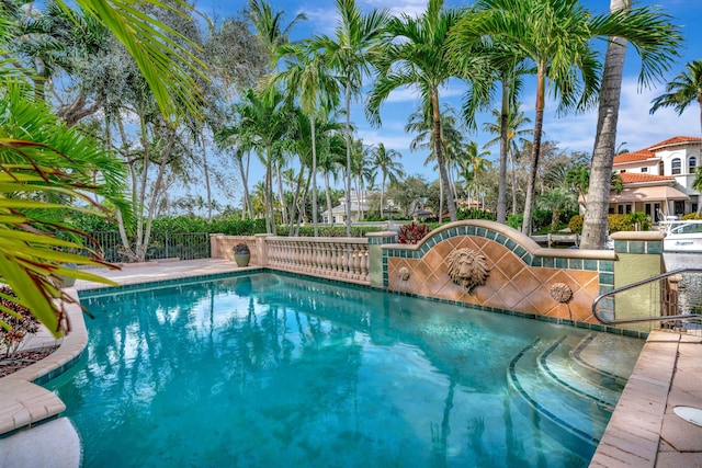 view of pool featuring grilling area