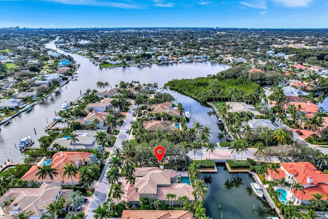 birds eye view of property featuring a water view