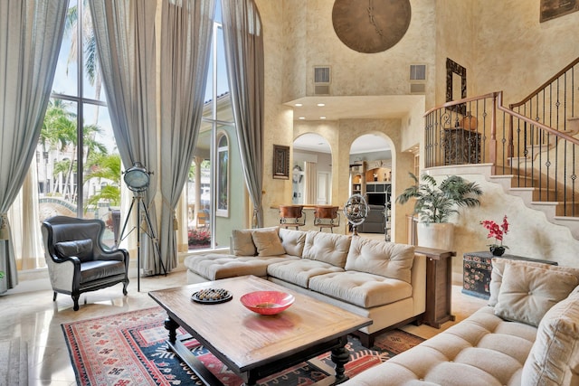 living room with a towering ceiling