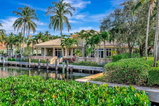 rear view of house with a water view