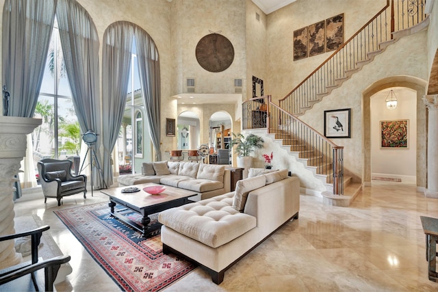 living room featuring a towering ceiling