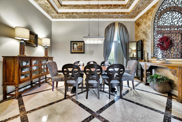 dining room with a raised ceiling and ornamental molding