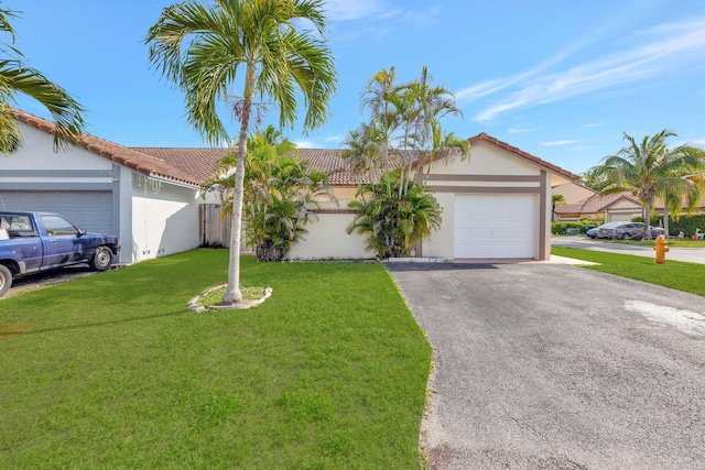 ranch-style house with a front yard and a garage