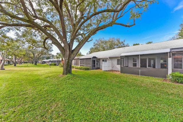 view of yard featuring a sunroom