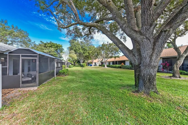 view of yard with a sunroom