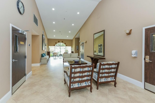 living room with light tile patterned floors and vaulted ceiling