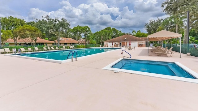 view of swimming pool with a patio