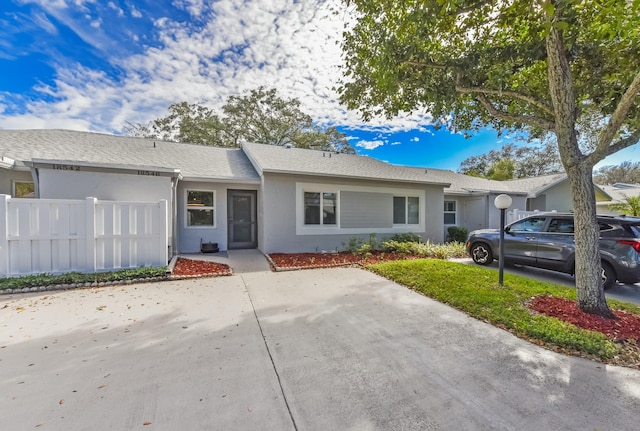 ranch-style house featuring a garage