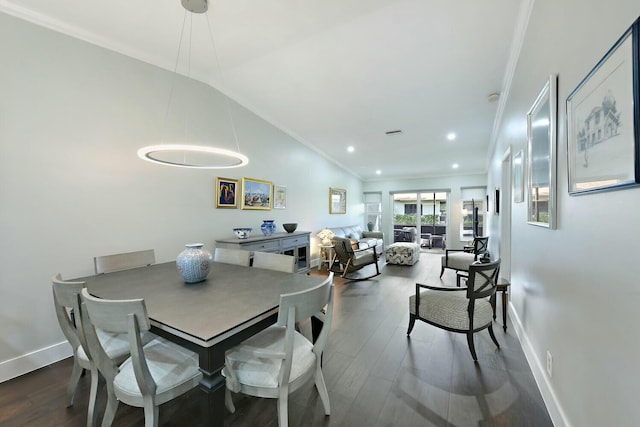 dining space with crown molding, dark wood-type flooring, and vaulted ceiling