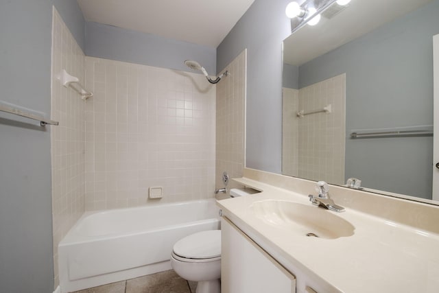 full bathroom featuring tile patterned flooring, vanity, toilet, and washtub / shower combination