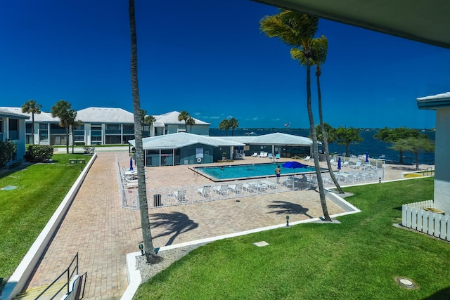 view of pool featuring a yard and a patio