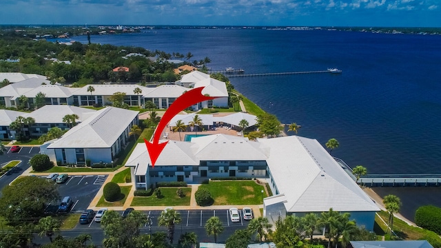 birds eye view of property with a water view