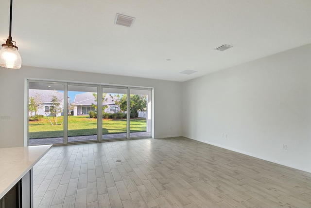 empty room featuring light hardwood / wood-style flooring