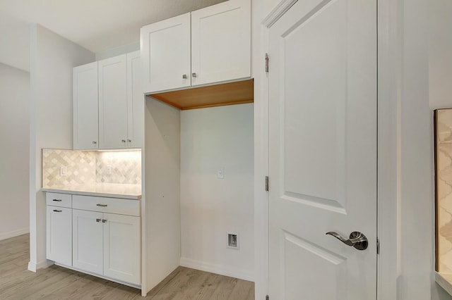 washroom with light wood-type flooring