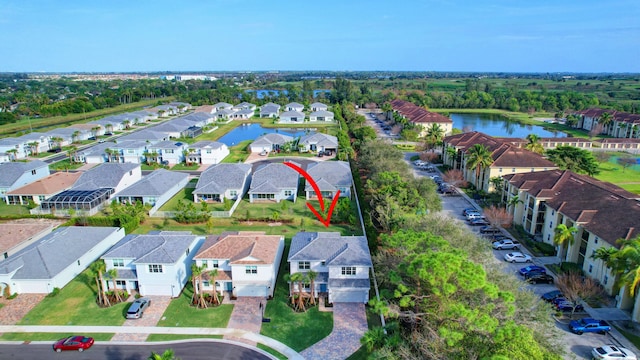 birds eye view of property with a water view