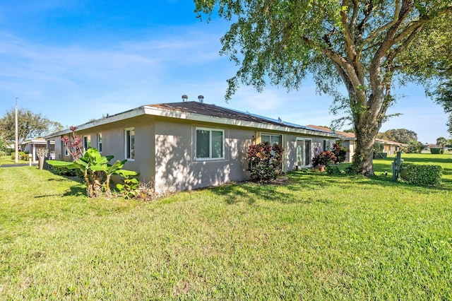 view of home's exterior featuring a lawn