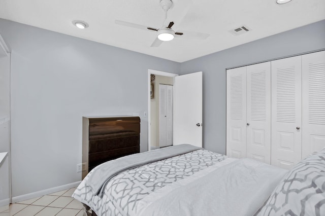 tiled bedroom featuring a closet and ceiling fan