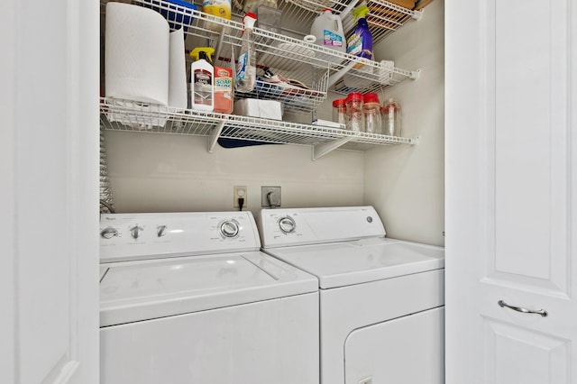 laundry room featuring separate washer and dryer