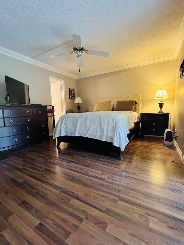 bedroom featuring a textured ceiling, ceiling fan, dark hardwood / wood-style floors, and ornamental molding