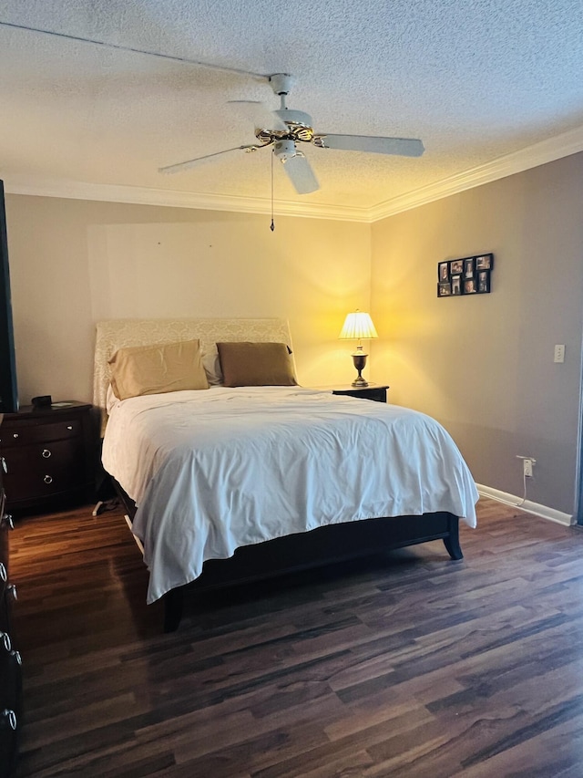 bedroom featuring a textured ceiling, dark hardwood / wood-style flooring, ceiling fan, and ornamental molding