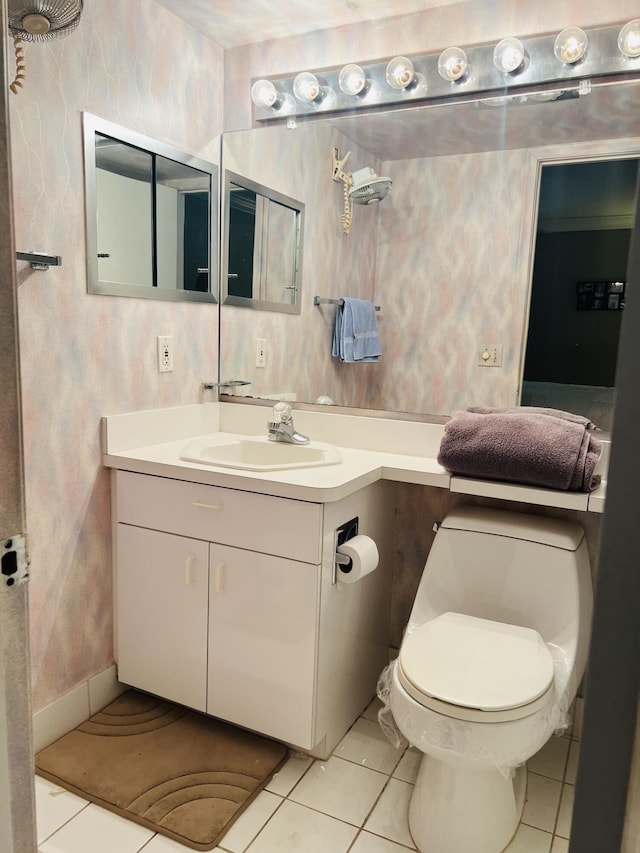 bathroom with tile patterned floors, vanity, and toilet