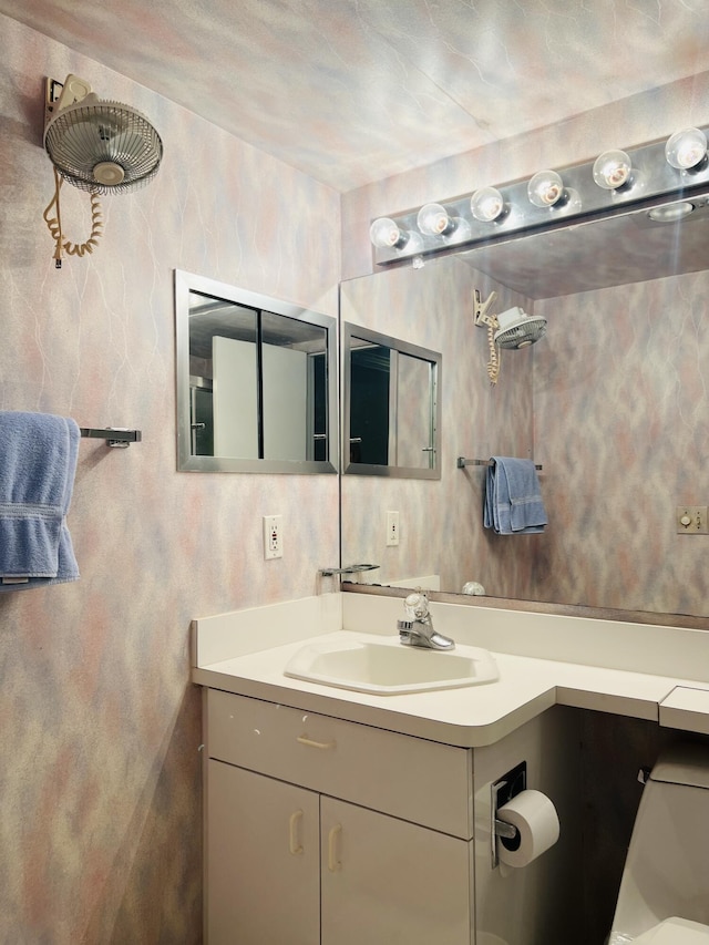 bathroom with vanity and toilet