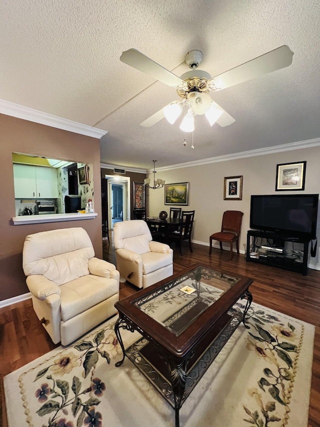 living room with a textured ceiling, ceiling fan with notable chandelier, dark hardwood / wood-style flooring, and crown molding