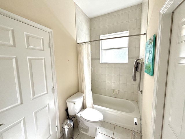 bathroom with tile patterned floors, shower / bath combo, and toilet