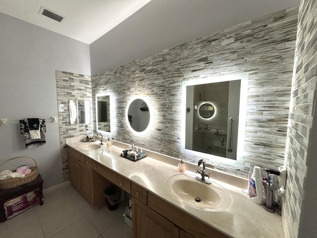 bathroom featuring tile patterned floors, tasteful backsplash, and vanity